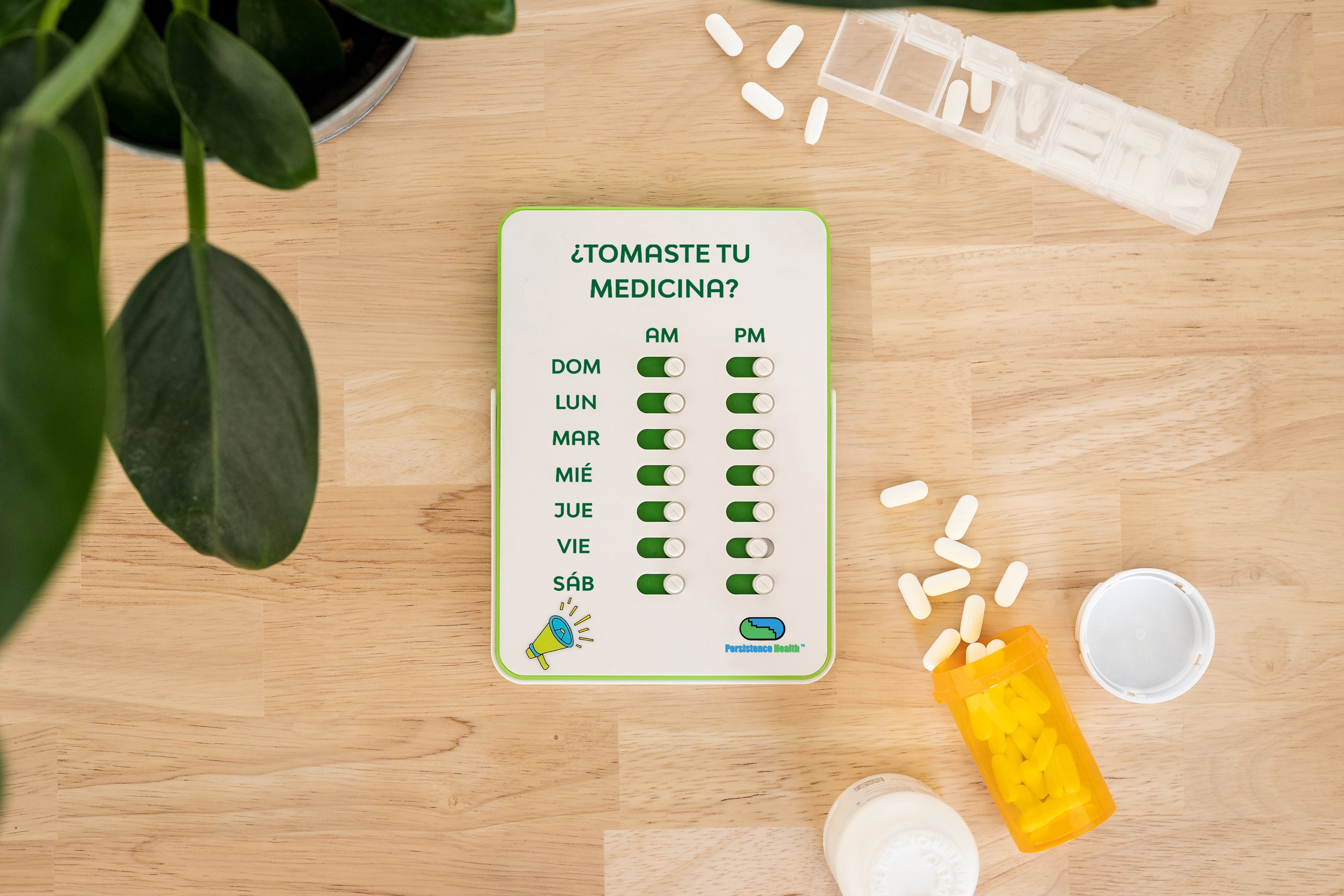 Medication reminder chart on a wooden surface with pills and a bottle.