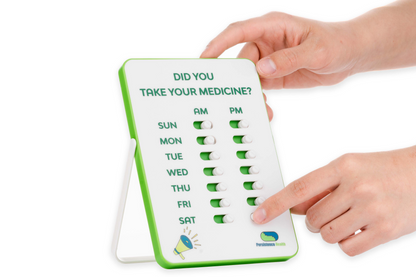 Handheld device with medication reminder system on a white background